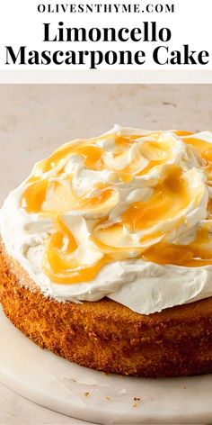 a close up of a cake on a plate with whipped cream and caramel sauce