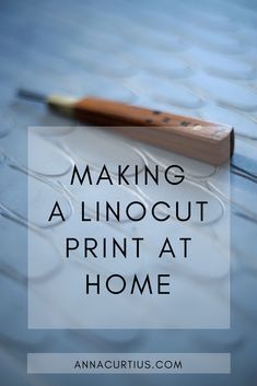 a pencil sitting on top of a piece of paper with the words making a linocut print at home