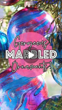 colorful marbled ornaments hanging from a tree with text that reads gorgeous marbled ornaments