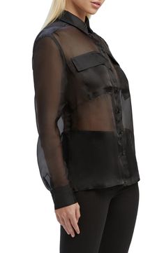 Move easily from day to night in this sheer organza shirt designed with solid trim. 25" length (size 4) Front button closure Spread collar Long sleeves with button cuffs Chest flap pockets 100% polyester Hand wash, line dry Imported Spring Organza Tops For Workwear, Sheer Collared Party Tops, Sheer Silk Office Blouse, Sheer Fitted Button-up Shirt, Sheer Collared Blouse For Office, Fitted Sheer Button-up Shirt, Sheer Collared Tops For Party, Sheer Collared Office Blouse, Long Sleeve Organza Tops For Work