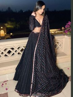 Look like an angel adorning this black color lehenga in blooming georgette material embellished with all-over multi sequins lining work comes with micro inner and attached canvas. 
Paired with similar choli and sequins worked dupatta in georgette both in black color. 
Lehenga Typ: Semi-stitched 
Lehenga Length: 41 inches 
Lehenga Flair: 3.60 Meter 
Blouse: 1.00 Meter
Dupatta: 2.30 meter Sangeet Outfit Sisters Black, Sangeet Lehenga Sisters, Sangeet Lehenga For Bridesmaid, Sequence Lehenga Party Wear, Sangeet Dress For Bride Sister, Sangeet Outfit Sisters, Sangeet Inspiration, Bride's Sister, Blouses Pattern