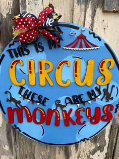 a sign that says circus, there are many monkeys