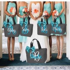 the bridesmaids are holding their bags in front of them