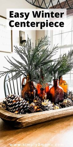 an easy winter centerpiece with pine cones and vases