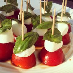 small appetizers with tomatoes and mozzarella on sticks