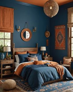 a bed room with a neatly made bed and blue walls