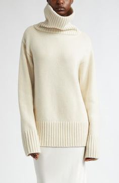 A dramatically oversized turtleneck brings scarf-inspired warmth to this roomy sweater knit from pure cashmere in a pale ivory hue. 27" length (size Large) Turtleneck Long sleeves Dropped shoulders Ribbed cuffs and hem 100% cashmere Dry clean Imported Designer Clothing Ivory Cashmere Sweater, Oversize Turtleneck, Oversized Sweater Women, Latest Sweater, Camel Sweaters, Oversized Turtleneck, Cashmere Sweater Women, Wool Jumper, Cashmere Turtleneck