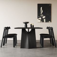 three chairs and a table in a room