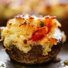 a close up of food on a plate with broccoli and cheese in it