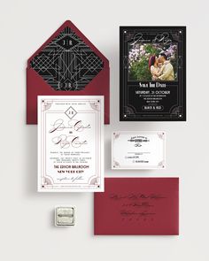 an assortment of wedding stationery items including a red envelope, black and white save the date cards, and a photo of a bride and groom