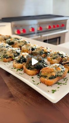 a white plate topped with lots of food on top of a counter