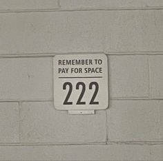 a sign that is on the side of a wall saying, remember to pay for space