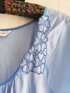 This is a vintage Vanity Fair night gown. It has short sleeves. It is light blue. There are 2 floral appliques. It is a long gown and is marked a size medium. (I know this is wrinkled, but it has been in a trunk for over 30 years. This was made in the USA. The measurements are as follow: (All measurements taken flat) Armpit to armpit: 21 inches Waist: 26.5 inches Hips: 29 inches Length from back: 51 inches This may seem too big for a size medium, but it is meant to be loose. Don't forget to stop Blue V-neck Nightgown For Home, Vintage Blue Nightgown For Home, Vintage Blue Nightgown For Hospital, Women's Nightgowns, Vintage Vanity, Floral Applique, Long Gown, Vanity Fair, 30 Years