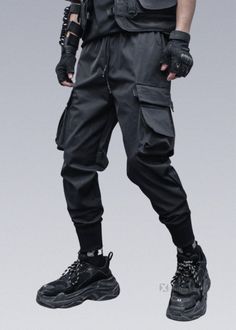 Heavy Industry Darkwear Black Tactical Trousers */. FEATURES & DETAILS: You might also like these combat pants-inspired edgy pants. Explore other urban tech apparel styles with the Techwear pants collection, including harem pants, joggers, jeans, or cargo pants for both men and women. Choose from black, gray, camo, and other colors. For a complete techwear look, combine these pants with another garment from the Techwear apparel line for an urban crossover look with tech fabrics.  Loose fit Techw Black Combat Trousers, Assassin Clothing, Edgy Pants, Techwear Shirt, Cyberpunk Pants, Techwear Women, Black Techwear, Tech Outfit, Combat Clothes