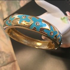 Nwot Gold & Turquoise Enamel Floral Hinge Bangle With Crystal Accents Like New/Worn Once (I’ve Never Been Able To Get Use To Bangles Really, My Wrists Are So Small) This Bangle Is Gorgeous And A Definite Statement Piece :) Super Shiny And Turquoise Enamel Flowers With Crystal Accents Very Sturdy, Thick And Made Well Spring Open Hinge It Fits Most Any Wrist 7 1/2” Or Above *Offers Are Welcome* Thank You For Shopping My Closet Blue Round Jewelry For Spring, Round Blue Jewelry For Spring, Blue Round Spring Jewelry, Spring Turquoise Bracelet Jewelry, Spring Turquoise Jewelry Bracelet, Elegant Blue Bracelets For Spring, Spring Party Blue Bracelets, Enamel Flowers, Enamel Flower