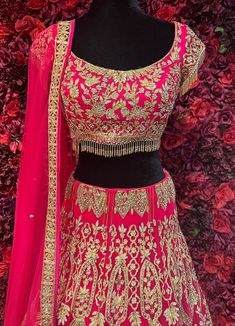 Add a pop of color to your wardrobe with the Tamanna Lehenga. This luxurious silk lehenga choli in hot pink is adorned with sequin embellishments, giving it an extra touch of sophistication. Be the center of attention with this chic and sensual piece. Experience timeless elegance and make a statement with Tamanna Lehenga. Crafted from the finest silk, this hot pink lehenga choli is delicately designed with shimmering sequins for a touch of luxury. Elevate your style with this alluring and captiv Tamanna Lehenga, Pink Art Silk Choli For Designer Wear, Elegant Pink Dola Silk Choli, Designer Pink Art Silk Lehenga, Pink Dola Silk Traditional Wear For Party, Elegant Pink Art Silk Lehenga, Traditional Embellished Pink Choli, Fitted Pink Choli With Intricate Embroidery, Elegant Pink Choli For Festivals