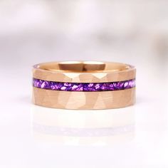 an image of a wedding ring with purple stones