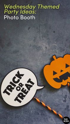 halloween themed party ideas photo booth sign and trick or treat pinatas on a gray background