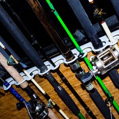 many fishing rods are lined up on the floor