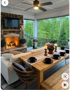 a living room filled with furniture and a fire place in front of a flat screen tv