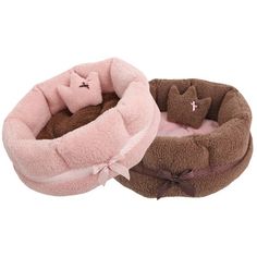 two dog beds with teddy bears on them, one is pink and the other is brown