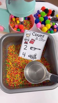 a bowl filled with colorful sprinkles next to a sign that says count and stir