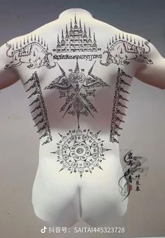 the back of a man with tattoos on his body and arms, all in white