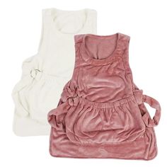 two pieces of pink and white clothing sitting next to each other on a white surface