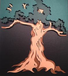 a paper cut out of a tree with birds flying around it on a black background