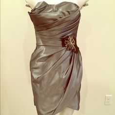 Nwot Never Worn. Built In Bra For Comfort And Stability. Beautiful Gunmetal Grey Color Glamorous Silver Satin Mini Dress, Gray Satin Party Dress, Elegant Silver Strapless Mini Dress, Elegant Metallic Silver Mini Dress For Spring, Elegant Gray Mini Dress For Formal Occasion, Gray Elegant Mini Dress For Formal Occasions, Elegant Silver Satin Mini Dress, Formal Silver Satin Dress, Metallic Silver Sleeveless Elegant Mini Dress