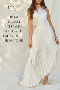 a woman in a white dress with the words,'minit bridal elegance souf