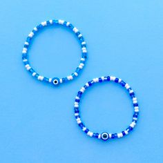 This listing is for 1 (one) evil eye stacker bracelet! Please make your color selection using the drop down menu. *These do not come with a letter bead bracelet or the daisies bracelet and the video is just to show an example of what they look like stacked with our other bracelets. The video shows the dark blue option :) *Link to the evil eye daisy bracelet: https://www.etsy.com/listing/1769553913/ *Link to our custom letter bead bracelets: https://www.etsy.com/listing/940495777/ Handmade with love using Czech glass beads and elastic stretch cord. SIZING: Measure your wrist around the widest point and add .25-.5 inches to get the most comfortable or desired fit. If you don't have a flexible tape measure, you can use a piece of string to wrap around your wrist and then measure the length of Everyday Evil Eye Beaded Bracelets, Everyday Evil Eye Bracelets With Round Beads, Seed Bead Evil Eye, Letter Bead Bracelet, Bead Evil Eye, Letter Bead Bracelets, Daisy Bracelet, Kawaii Aesthetic, Letter Beads