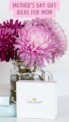 pink flowers in a glass vase with a note that says mother's day gift ideas for mom