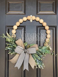 a wreath is hanging on the front door