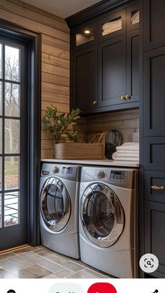 a washer and dryer sitting in front of a window next to a door