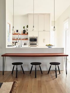 the kitchen is clean and ready to be used as a dining room or breakfast nook