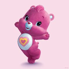 a pink teddy bear with a heart on it's chest and arms in the air