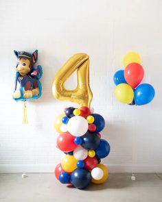 balloons are arranged in the shape of animals and numbers