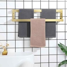 two towels are hanging on a towel rack