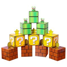 a pile of question boxes sitting on top of each other in front of a white background