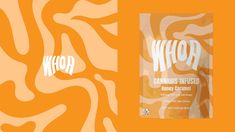 a bag of wheyr next to an orange and white zebra print wallpaper