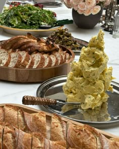 an assortment of baked goods displayed on serving platters