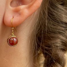 Red Acrylic Wrapped Gold Bead Earring made with gold iron wire wrapped delicately around a acrylic bead. All earrings here are crafted with love and care 🥰 These are the perfect earrings for a thoughtful gift or a way to treat yourself. The earrings are simple and designed to make you shine ✨ 14k Gold Filled Beaded Earrings For Gift, 14k Gold Filled Beaded Earrings As Gift, Single Round Beaded Earring As A Gift, Rose Gold Earrings With Round Beads For Gift, 14k Gold Filled Wire Wrapped Earrings For Gift, Gift Round Beaded Single Earring, Hypoallergenic Round Beaded Earrings For Gift, Wire Wrapped Beaded Dangle Earrings For Gift, Wire Wrapped Beaded Dangle Earrings As Gift