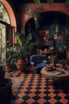 a living room filled with furniture and lots of plants