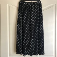 Blue Skirt With Cream Poke A Dots. It’s Pleated With Elastic Waist. This Skirt Has Never Been Worn. Spring Polka Dot Long Skirt, Polka Dot Long Skirt For Spring, Casual Polka Dot Skirt With Elastic Waistband, Polka Dot Lined Skirt Bottoms For Spring, Chic Polka Dot Long Skirt, Casual Polka Dot Pleated Skirt, Casual Long Polka Dot Skirt, Chic Polka Dot Midi Skirt, Casual Polka Dot Flowy Skirt