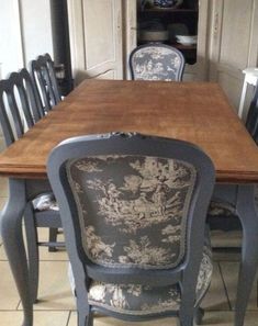 a dining room table with chairs around it