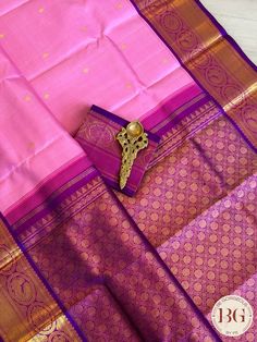 Indulge yourself in the luxury of our Kanjeevaram pure silk handloom saree in a beautiful pink and purple color combination. Handcrafted with intricate details and made from pure silk, this saree is not only a stunning addition to your wardrobe but also a timeless piece of art. Elevate your style and make a statement with this exclusive saree. Kanjeevaram pure silk handloom saree - pink purple Saree comes with a blouse piece. Fall and pico done. Fully stitched blouse shown in pictures is optional and can be purchased seperately from our blouses and croptops section. For saree video please connect with us on whatsapp @469-937-0606 Ready to be shipped in USA from San Diego, California. All pictures are original pictures. Colors may slightly vary due to pic resolution. Diwali Pink Silk Mark Certified Saree, Festive Pink Silk Mark Certified Saree, Pink Silk Mark Certified Saree, Silk Mark Certified Pink Saree, Pink Silk Mark Certified Traditional Wear For Diwali, Traditional Pink Silk Mark Certified Saree, Elegant Pink Saree For Puja, Pink Traditional Silk Mark Certified Wear, Pink Silk Mark Certified Traditional Wear