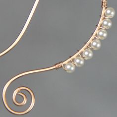 "These unique serpentine spiral hoop earrings are handmade using 14k rose gold filled wire and pearl. Perfect gift for any occasion! Free U.S shipping! Anni Designs. In art, serpentine line is called\"The Line of Beauty\". S curves modulate from one gradient to another. S curves signify liveliness and activity and excite the attention of the viewer. The design is inspired by Rococo style. Rococo style is elegant, ornate and use a lot of S curves. It is playful and witty. Despite it popularity am Elegant Wire Wrapped Wrap Earrings As Gift, Elegant Rose Gold Copper Wire Jewelry, Elegant Adjustable Wire Wrap Earrings, Elegant Copper Wrap Earrings, Elegant Handmade Wire Wrap Earrings, Handmade Rose Gold Wrap Earrings, Elegant Handmade Wrap Wire Earrings, Handmade Rose Gold Wrap Earrings Gift, Wiring Earrings