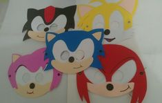 several masks with different colors and designs on them, including the faces of sonic the hedgehog