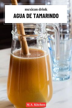 a pitcher filled with liquid sitting on top of a table